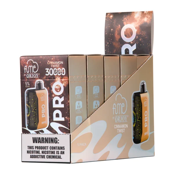 A sleek 3 battery vape mod sitting on a modern desk with a glass drip tip, highlighting its advanced design and size compared to traditional vapes